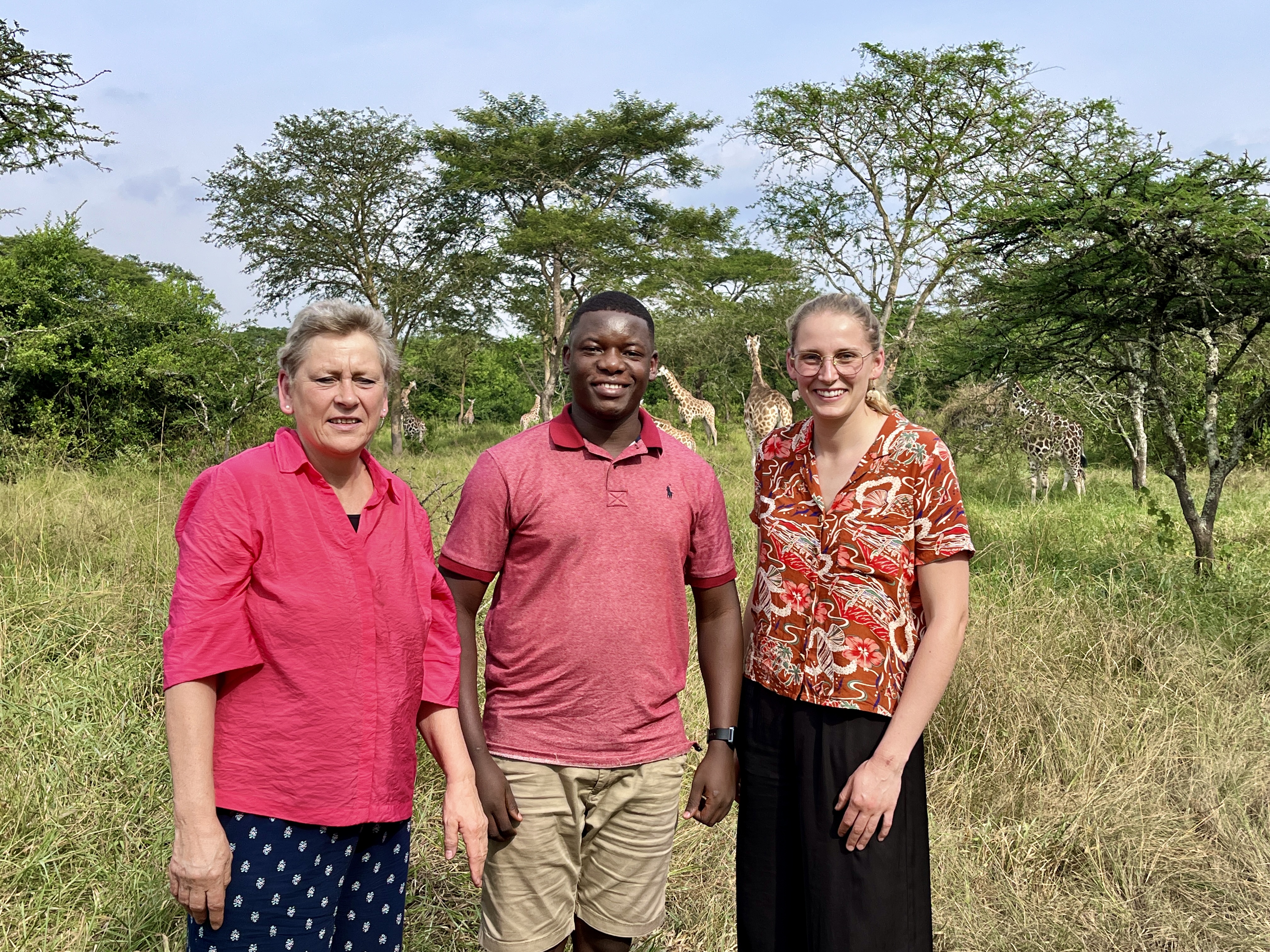 Happy travelers exploring Uganda